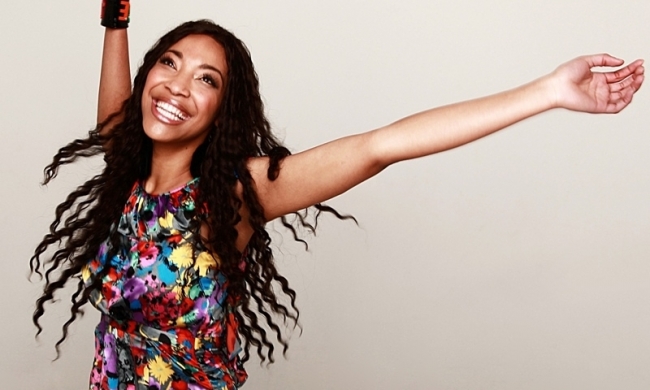 confident_black_woman_in_braids_and_colorful_dress_1